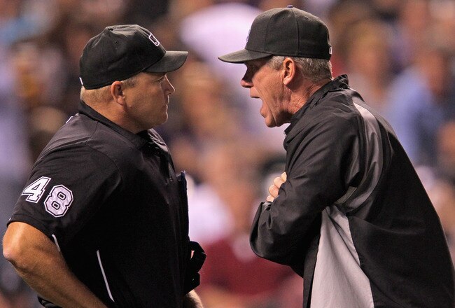 DENVER, CO - SEPTEMBER 09:  Manager Jim Tracy #4 of the Colorado Rockies has words with homeplate umpire Mark Carlson #48 after Carlson ejected Carlos Gonzalez #5 of the Colorado Rockies and subsequently ejecting Tracy in the fifth inning at Coors Field on September 9, 2011 in Denver, Colorado.  (Photo by Doug Pensinger/Getty Images)