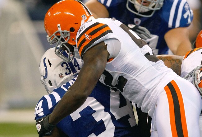 INDIANAPOLIS, IN - SEPTEMBER 18:  DeLone Carter #34 of the Indianapolis Colts is tackled by D'Qwell Jackson #52 during the game against the Cleveland Browns at Lucas Oil Stadium on September 18, 2011 in Indianapolis, Indiana. (Photo by Scott Boehm/Getty Images)
