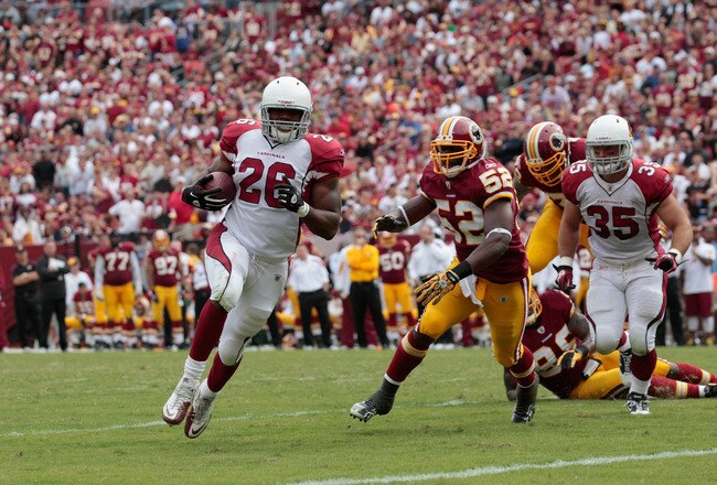 LANDOVER, MD - SEPTEMBER 18:  Running back  Beanie Wells #26 of the Arizona Cardinals rushes for a touchdown in front of defender Rocky McIntosh #52 of the Washington Redskins during the second half at FedExField on September 18, 2011 in Landover, Maryland. Washington defeated the Arizona 22-21.  (Photo by Rob Carr/Getty Images)