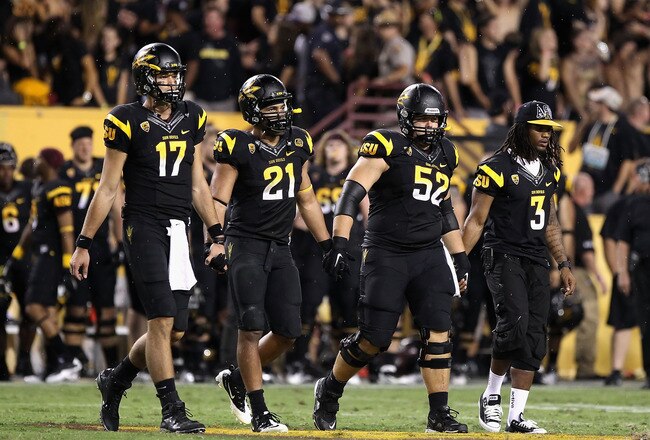 TEMPE, AZ - SEPTEMBER 09:  (L-R) Brock Osweiler #17, Colin Parker #21, Garth Gerhart #52 and Omar Bolden #3 of the Arizona State Sun Devils walk out to the overtime coin toss together during the college football game against the Missouri Tigers at Sun Devil Stadium on September 9, 2011 in Tempe, Arizona. The Sun Devils defeated the Tigers 37-30 in overtime. (Photo by Christian Petersen/Getty Images)