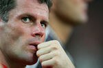 KUALA LUMPUR, MALAYSIA - JULY 16: Jamie Carragher of Liverpool watches from the touchline during the pre-season friendly match between Malaysia and Liverpool at the Bukit Jalil National Stadium on July 16, 2011 in Kuala Lumpur, Malaysia. (Photo by Stanley Chou/Getty Images)