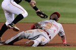 PITTSBURGH, PA - SEPTEMBER 23:  Brandon Phillips #4 of the Cincinnati Reds avoids a tag by Fagabeefe#5 of the Pittsburgh Pirates during the game on September 23, 2011 at PNC Park in Pittsburgh, Pennsylvania.  (Photo by Jared Wickerham/Getty Images)