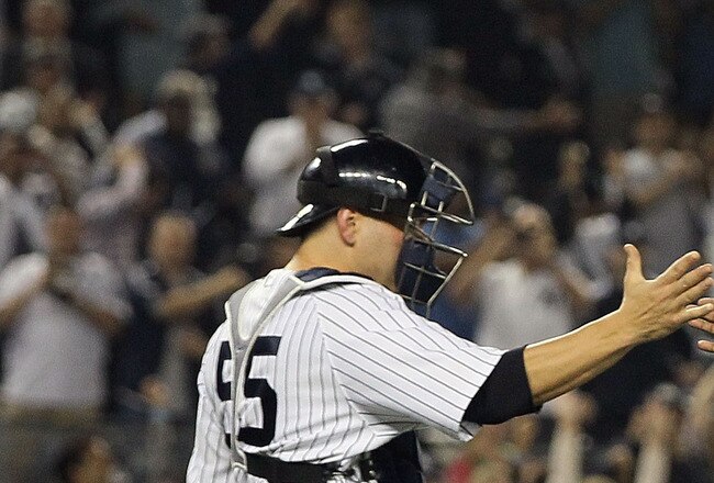NEW YORK, NY - SEPTEMBER 21:  Rafael Soriano #29 and Russell Martin #55 of the New York Yankees celebrate after clinching the American League East division against the Tampa Bay Rays on September 21, 2011 at Yankee Stadium in the Bronx borough of New York City.  (Photo by Jim McIsaac/Getty Images)