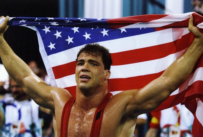 31 Jul 1996: Kurt Angle of the United States holds the American flag at the free-style wrestling competition during the Summer Olympics at the Georgia World Congress Center in Atlanta, Georgia.