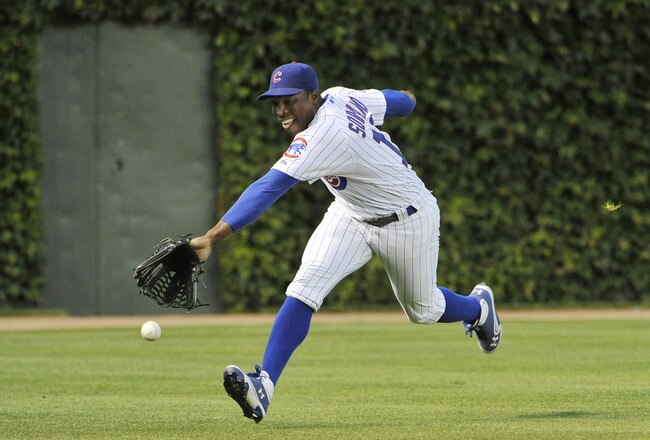CHICAGO, IL - SEPTEMBER 07:  Left fielder Alfonso Soriano #12 of the Chicago Cubs cannot get to a triple hit by Joey Votto #19 of the Cincinnati Reds during the first inning at Wrigley Field on September 7, 2011 in Chicago, Illinois.  (Photo by Brian Kersey/Getty Images)