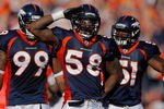DENVER, CO - SEPTEMBER 18:  Linebacker Von Miller #58 of the Denver Broncos salutes to the fans and celebrates with teammates defensive tackle Kevin Vickerson #99 and linebacker Joe Mays #51 after making a sack on Cincinnati Bengals quarterback Andy Dalton during the fourth quarter at Sports Authority Field at Mile High on September 18, 2011 in Denver, Colorado. (Photo by Justin Edmonds/Getty Images)
