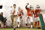 MIAMI, FL - SEPTEMBER 17: Head Coach Al Golden of the Miami Hurricanes leads the team onto the field for his first home game against the Ohio State Buckeyes on September 17, 2011 at Sun Life Stadium in Miami, Florida. The Hurricanes defeated the Buckeyes 24-6. (Photo by Joel Auerbach/Getty Images)