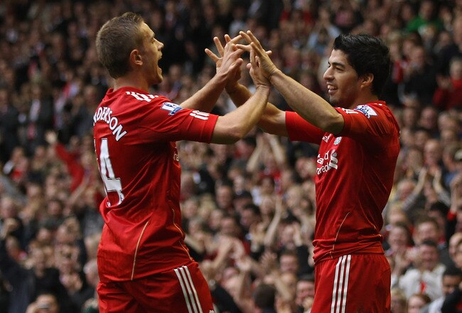 LIVERPOOL, ENGLAND - SEPTEMBER 24:  Luis Suarez (R) of Liverpool celebrates scoring the second goal with team mate Jordan Henderson during the Barclays Premier League match between Liverpool and Wolverhampton Wanderers at Anfield on September 24, 2011 in Liverpool, England.  (Photo by Clive Brunskill/Getty Images)