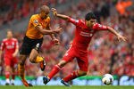 LIVERPOOL, ENGLAND - SEPTEMBER 24:  Luis Suarez (R) of Liverpool attempts to move away from Karl Henry of Wolverhampton Wanderers during the Barclays Premier League match between Liverpool and Wolverhampton Wanderers at Anfield on September 24, 2011 in Liverpool, England.  (Photo by Clive Brunskill/Getty Images)