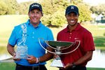 ATLANTA - SEPTEMBER 27:  Phil Mickelson (L), winner of THE TOUR Championship presented by Coca-Cola poses alongside Tiger Woods, winner of the 2009 FedExCup at East Lake Golf Club on September 27, 2009 in Atlanta, Georgia.  (Photo by Scott Halleran/Getty Images)