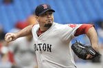 TORONTO, CANADA - SEPTEMBER 05:  Josh Beckett #19 of the Boston Red Sox delivers a pitch during MLB game action against the Toronto Blue Jays September 5, 2011 at Rogers Centre in Toronto, Ontario, Canada. (Photo by Brad White/Getty Images)