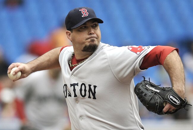 TORONTO, CANADA - SEPTEMBER 05:  Josh Beckett #19 of the Boston Red Sox delivers a pitch during MLB game action against the Toronto Blue Jays September 5, 2011 at Rogers Centre in Toronto, Ontario, Canada. (Photo by Brad White/Getty Images)