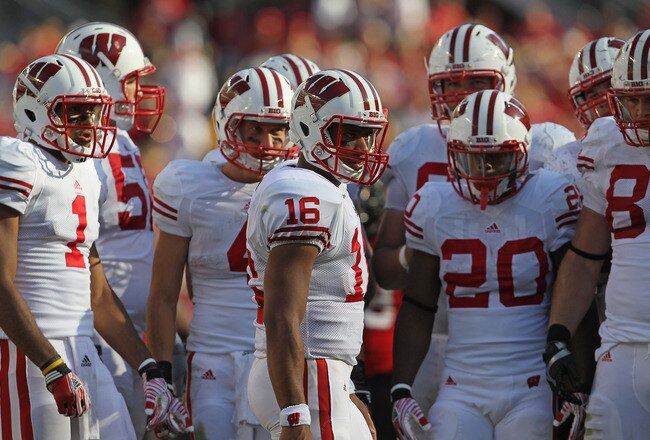 CHICAGO, IL - SEPTEMBER 17:  Russell Wilson #16 of the Wisconsin Badgers gets ready to call a play in the huddle against the Northern Illinois Huskies at Soldier Field on September 17, 2011 in Chicago, Illinois. Wisconsin defeated Northern Illinois 49-7.  (Photo by Jonathan Daniel/Getty Images)