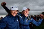 DUNSHAUGHLIN, IRELAND - SEPTEMBER 25:  Sophie Gustafson (L) and Suzann Pettersen of Europe celebrate their team's victory on the 18th green during the singles matches on day three of the 2011 Solheim Cup at Killeen Castle Golf Club on September 25, 2011 in Dunshaughlin, County Meath, Ireland.  (Photo by Ian Walton/Getty Images)