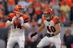 DENVER, CO - SEPTEMBER 18:  Quarterback Andy Dalton #14 of the Cincinnati Bengals looks for a receiver offensive guard Clint Boling #65 and half back Brian Leonard #40 of the Cincinnati Bengals against the Denver Broncos at Sports Authority Field at Mile High on September 18, 2011 in Denver, Colorado. The Broncos defeated the Bengals 24-22.  (Photo by Doug Pensinger/Getty Images)