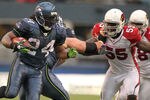 SEATTLE - OCTOBER 24:  Running back Marshawn Lynch #24 of the Seattle Seahawks rushes against Joey Porter #55 of the Arizona Cardinals at Qwest Field on October 24, 2010 in Seattle, Washington. (Photo by Otto Greule Jr/Getty Images)