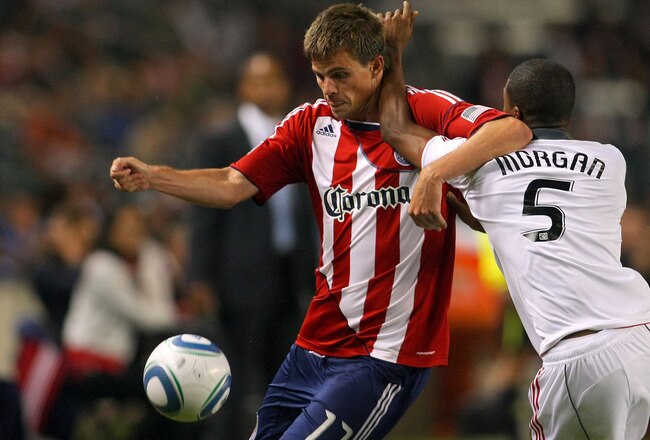 CARSON, CA - SEPTEMBER 24:  Justin Braun #17 of Chivas USA tries to get past Ashtone Morgan #5 of Toronto FC to play the ball on the attack in the second half during the MLS match at The Home Depot Center on September 24, 2011 in Carson, California. Chivas USA defeated Toronto FC 3-0.  (Photo by Victor Decolongon/Getty Images)