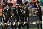 WASHINGTON, DC - SEPTEMBER 24: Andy Najar #14 of D.C. United celebrates with Dwayne De Rosario #7 after scoring a goal against Real Salt Lake at RFK Stadium on September 24, 2011 in Washington, DC. (Photo by Ned Dishman/Getty Images)