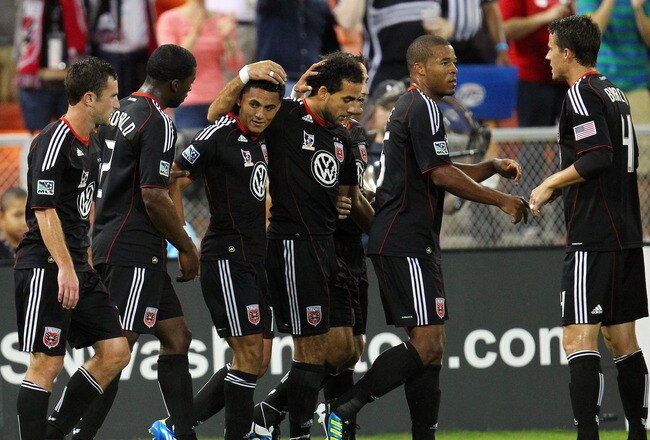 WASHINGTON, DC - SEPTEMBER 24: Andy Najar #14 of D.C. United celebrates with Dwayne De Rosario #7 after scoring a goal against Real Salt Lake at RFK Stadium on September 24, 2011 in Washington, DC. (Photo by Ned Dishman/Getty Images)