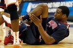 TULSA, OK - MARCH 20:  Kevin Parrom #3 of the Arizona Wildcats grabs his ankle after an injury during the third round game against the Texas Longhorns in the 2011 NCAA men's basketball tournament at BOK Center on March 20, 2011 in Tulsa, Oklahoma.  (Photo by Tom Pennington/Getty Images)