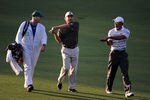 AUGUSTA, GA - APRIL 05:  Tiger Woods (R) and Fred Couples walk alongside caddie Joe Lacava down the first fairway during a practice round prior to the 2010 Masters Tournament at Augusta National Golf Club on April 5, 2010 in Augusta, Georgia.  (Photo by Harry How/Getty Images)