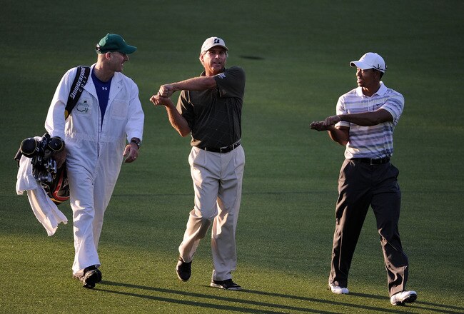 AUGUSTA, GA - APRIL 05:  Tiger Woods (R) and Fred Couples walk alongside caddie Joe Lacava down the first fairway during a practice round prior to the 2010 Masters Tournament at Augusta National Golf Club on April 5, 2010 in Augusta, Georgia.  (Photo by Harry How/Getty Images)
