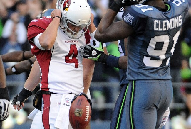 SEATTLE, WA - SEPTEMBER 25:  Kam Chancellor #31 of the Seattle Seahawks celebrates his interception in front of quarterback Kevin Kolb #4 of the Arizona Cardinals during the fourth quarter at CenturyLink Field on September 25, 2011 in Seattle, Washington.  (Photo by Harry How/Getty Images)