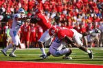 NEW BRUNSWICK, NJ - SEPTEMBER 25:  Mohamed Sanu #6 of the Rutgers Scarlet Knights successfully scores a touchdown by breaking the tackle of Tre Boston #10 of the North Carolina Tar Heels in the second quarter at Rutgers Stadium on September 25, 2010 in New Brunswick, New Jersey.  (Photo by Andrew Burton/Getty Images)