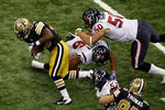NEW ORLEANS, LA - SEPTEMBER 25:   Darren Sproles #43 of the New Orleans Saints slips a tackle by  James Casey #86 of the Houston Texans  at Louisiana Superdome on September 25, 2011 in New Orleans, Louisiana.  (Photo by Chris Graythen/Getty Images)