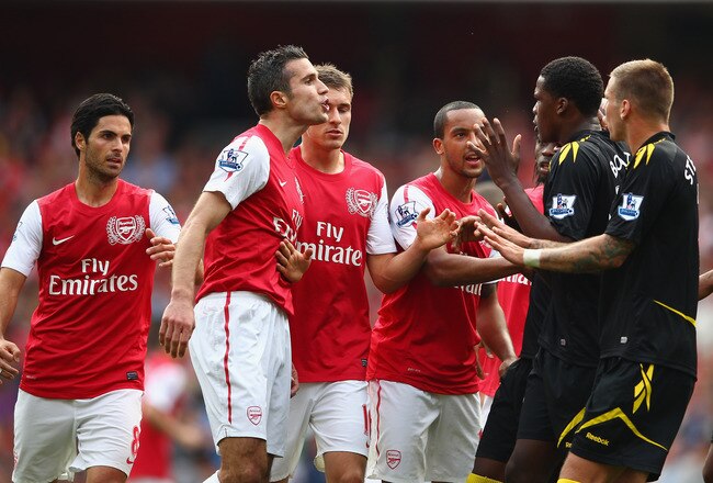 LONDON, ENGLAND - SEPTEMBER 24:  Robin Van Persie of Arsenal has words with Bolton Wanderers players during the Barclays Premier League match between Arsenal and Bolton Wanderers at Emirates Stadium on September 24, 2011 in London, England.  (Photo by Clive Mason/Getty Images)