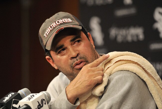 CHICAGO, IL - SEPTEMBER 26:  Manager Ozzie Guillen #13 of the Chicago White Sox speaks to reporters at a news conference after the White Sox defeated the Toronto Blue Jays 4-3 at U. S. Cellular Field on September 26, 2011 in Chicago, Illinois. The White Sox agreed to Guillen's request to be released from his contract, allowing him to pursue other opportunities.   (Photo by Brian Kersey/Getty Images)