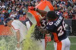 DENVER, CO - SEPTEMBER 18:  Head coach John Fox of the Denver Broncos is doused with Gatorade by Brian Dawkins #20 of the Denver Broncos after their 24-22 victory over the Cincinnati Bengals at Invesco Field at Mile High on September 18, 2011 in Denver, Colorado.  (Photo by Doug Pensinger/Getty Images)