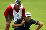 EDISON, NJ - AUGUST 27:  Dustin Johnson (R) and caddie Joe Lacava line up a putt on the 16th hole green during the third and final round of The Barclays at Plainfield Country Club on August 27, 2011 in Edison, New Jersey. The tournament was cut down from a 72 hole competition to 54 holes due to the the impending arrival of Hurricane Irene.  (Photo by Scott Halleran/Getty Images)