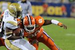 TAMPA, FL - NOVEMBER 28: Linebacker Brandon Maye #20 of the Clemson Tigers tackles running back Embry Peeples #24 of the Georgia Tech Yellow Jackets  in the 2009 ACC Football Championship Game December 5, 2009 at Raymond James Stadium in Tampa, Florida.  (Photo by Al Messerschmidt/Getty Images)