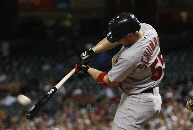 HOUSTON - SEPTEMBER 27:  Skipp Schumaker #55 of the St. Louis Cardinals doubles to  centerfield scoring Lance Berkman #12, Allen Craig and Yadier Molina in the fourth inning against the Houston Astros at Minute Maid Park on September 27, 2011 in Houston, Texas.  (Photo by Bob Levey/Getty Images)