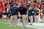 COLLEGE PARK, MD - SEPTEMBER 17:  Head coach Dana Holgorsen of the West Virginia Mountaineers yells at his team from the sidelines against the Maryland Terrapins during the first half at Byrd Stadium on September 17, 2011 in College Park, Maryland.  (Photo by Rob Carr/Getty Images)