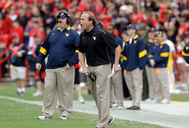 COLLEGE PARK, MD - SEPTEMBER 17:  Head coach Dana Holgorsen of the West Virginia Mountaineers yells at his team from the sidelines against the Maryland Terrapins during the first half at Byrd Stadium on September 17, 2011 in College Park, Maryland.  (Photo by Rob Carr/Getty Images)