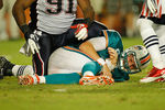 MIAMI GARDENS, FL - SEPTEMBER 12:  Chad Henne #7 of the Miami Dolphins is sacked during a game against the New England Patriots at Sun Life Stadium on September 12, 2011 in Miami Gardens, Florida.  (Photo by Mike Ehrmann/Getty Images)