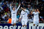 MADRID, SPAIN - SEPTEMBER 27:  Cristiano Ronaldo (L) of Real Madrid celebrates with Sergio Ramos (C) and Mesut Ozil after Kaka scored Real's second goal during the UEFA Champions League Group D match between Real Madrid and AFC Ajax at Estadio Santiago Bernabeu on September 27, 2011 in Madrid, Spain.  (Photo by Denis Doyle/Getty Images)
