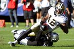 OAKLAND, CA - AUGUST 28:  Marques Colston #12 of the New Orleans Saints is dragged down at the one yard line by Tyvon Branch #33 of the Oakland Raiders in the first quarter during an NFL pre-season football game at the O.co Coliseum August 28, 2011 in Oakland, California. (Photo by Thearon W. Henderson/Getty Images)