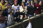 CHICAGO - OCTOBER 14:  Fans interfere with outfielder Moises Alou #18 of the Chicago Cubs on a ball hit by Luis Castillo #1 of the Florida Marlins in the eighth inning during Game 6 of the National League Championship Series October 14, 2003 at Wrigley Field in Chicago, Illinois.  (Photo by Elsa/Getty Images)