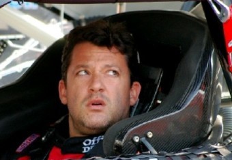 National Association  Stock  Auto Racing Tony Stewart on Tony Stewart Gets Ready To Practice And Checks With A Crew Member