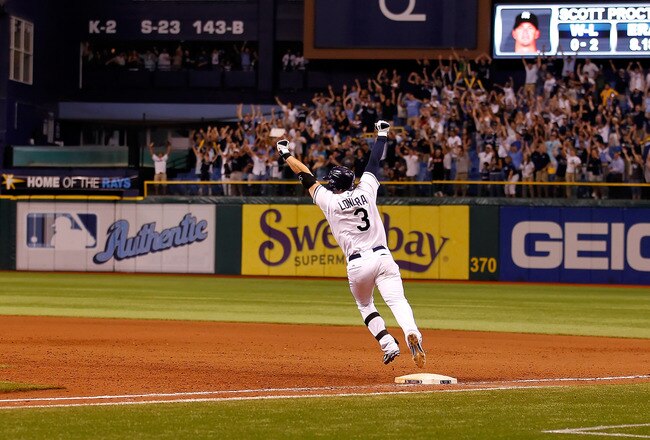 ST PETERSBURG, FL - SEPTEMBER 28:  Infielder Evan Longoria #3 of the Tampa Bay Rays rounds the bases after his bottom of the twelveth inning walk off home run against the New York Yankees during the game at Tropicana Field on September 28, 2011 in St. Petersburg, Florida.  (Photo by J. Meric/Getty Images)