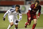 SANDY, UT-MARCH 26: Miguel Lopez #25 of Los Angeles Galaxy brings the ball down field as Kyle Beckerman #5 of Real Salt Lake gives chase during the first half of an MLS soccer game March 26, 2011 at Rio Tinto Stadium in Sandy, Utah. Real Salt Lake beat the Los Angeles Galaxy 4-1. (Photo by George Frey/Getty Images)