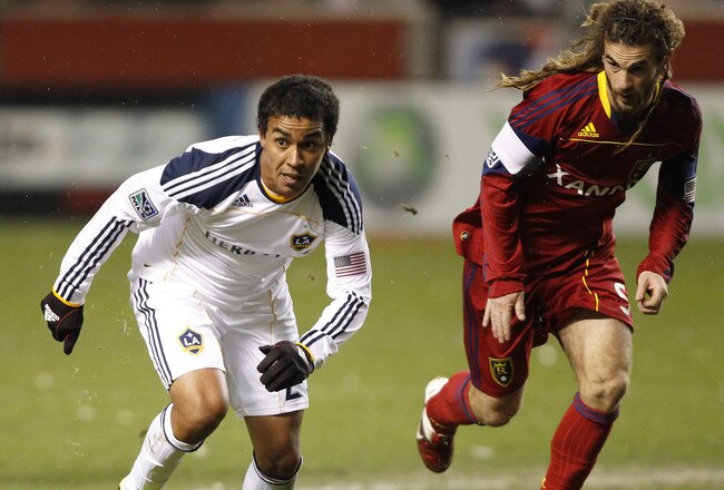 SANDY, UT-MARCH 26: Miguel Lopez #25 of Los Angeles Galaxy brings the ball down field as Kyle Beckerman #5 of Real Salt Lake gives chase during the first half of an MLS soccer game March 26, 2011 at Rio Tinto Stadium in Sandy, Utah. Real Salt Lake beat the Los Angeles Galaxy 4-1. (Photo by George Frey/Getty Images)