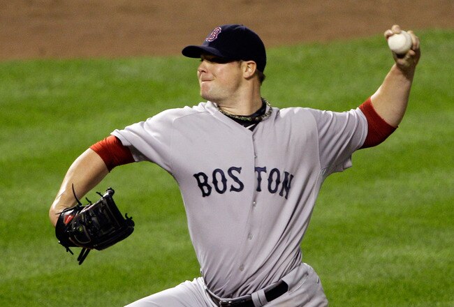 BALTIMORE, MD - SEPTEMBER 28: Jon Lester #31 of the Boston Red Sox pitches to a Baltimore Orioles batter during the fifth inning at Oriole Park at Camden Yards on September 28, 2011 in Baltimore, Maryland.  (Photo by Rob Carr/Getty Images)
