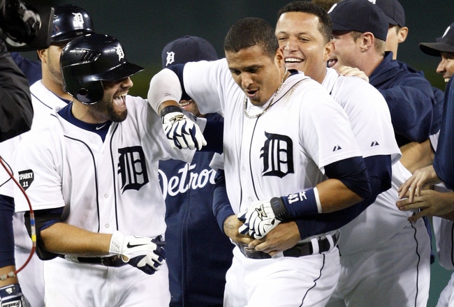 DETROIT, MI - SEPTEMBER 23:  Victor Martinez #41 of the Detroit Tigers is embraced by Miguel Cabrera #24 as Alex Avila looks on after a 4-3 victory over the Baltimore Orioles at Comerica Park on September 23, 2011 in Detroit, Michigan.  (Photo by Jorge Lemus/Getty Images)