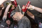 HOUSTON - SEPTEMBER 28:  Pitcher Chris Carpenter of the St. Louis Cardinals is showered with beer as they celebrate winning the National League wild card at Minute Maid Park on September 28, 2011 in Houston, Texas.  (Photo by Bob Levey/Getty Images)