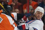 PHILADELPHIA, PA - SEPTEMBER 26: Sean Avery #16 of the New York Rangers is hit by Wayne Simmonds #17 of the Philadelphia Flyers during an NHL preseason game at Wells Fargo Center on September 26, 2011 in Philadelphia, Pennsylvania.  (Photo by Bruce Bennett/Getty Images)