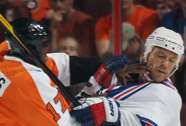 PHILADELPHIA, PA - SEPTEMBER 26: Sean Avery #16 of the New York Rangers is hit by Wayne Simmonds #17 of the Philadelphia Flyers during an NHL preseason game at Wells Fargo Center on September 26, 2011 in Philadelphia, Pennsylvania.  (Photo by Bruce Bennett/Getty Images)